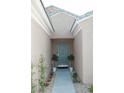 Welcoming front entrance with a stylish blue door, potted plants, and decorative landscaping leading to the home at 2623 Red Planet St, Henderson, NV 89044