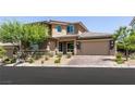 Charming two-story home features a three-car garage and landscaped yard at 2680 Nevada Agave Ln, Las Vegas, NV 89138
