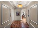 Inviting hallway with hardwood floors, coffered ceilings, and views into the open-concept kitchen and living areas at 2877 Paradise Rd # 2602, Las Vegas, NV 89109