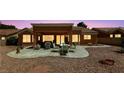 A comfortable patio features ample seating for outdoor dining and relaxation at 2925 Lotus Hill Dr, Las Vegas, NV 89134