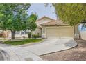 Charming single-story home featuring a well-manicured lawn and a two-car garage at 3539 Barrel Bronco Ct, North Las Vegas, NV 89032