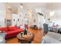 A bright and airy living room featuring hardwood floors, neutral walls, and an open floor plan at 3646 Billman Ave, Las Vegas, NV 89121