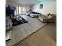 Spacious living room featuring tile flooring and comfortable couches at 3854 Chutney St, Las Vegas, NV 89121