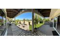 Spacious covered patio with outdoor seating and a built-in grill at 5041 Portraits Pl, Las Vegas, NV 89149
