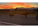 Scenic sunset view from the home overlooking the mountains and city lights at 5041 Portraits Pl, Las Vegas, NV 89149