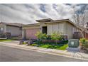 Attractive residence with an attached garage, brick-paved driveway, and lush artificial turf at 505 Sterling Falls Ave, Henderson, NV 89011
