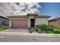 Inviting single-Gathering house featuring a two-car garage, manicured lawn, and a paved driveway at 505 Sterling Falls Ave, Henderson, NV 89011