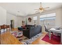 Bright living room with large windows, modern ceiling fan, and open access to other areas at 5317 Marietta Ave, Las Vegas, NV 89108