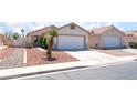 Attractive single-story home with a two-car garage, a concrete driveway, and minimal landscaping at 5524 La Pelusa St, North Las Vegas, NV 89031