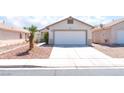 Lovely single-story home with a two-car garage, a concrete driveway, and desert landscaping at 5524 La Pelusa St, North Las Vegas, NV 89031