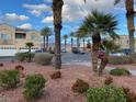 View of a home in a well-maintained community with mature landscaping and ample parking at 6316 Beige Bluff St # 201, North Las Vegas, NV 89081