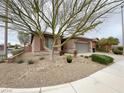 Charming single-story home with low-maintenance desert landscaping, and a two-car garage at 6946 Motley Rd, Las Vegas, NV 89178