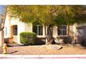 Inviting single-story home with well-maintained landscaping and mature shade trees at 7515 Splashing Rock Dr, Las Vegas, NV 89131