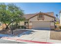 Attractive single-Gathering home boasts a well-manicured lawn and a welcoming two-car garage at 7515 Splashing Rock Dr, Las Vegas, NV 89131