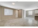 Bright living room featuring neutral paint, tile floors and large windows at 8486 Insignia Ave # 101, Las Vegas, NV 89178