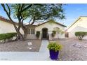 Charming single-story home with low-maintenance desert landscaping and an iron gate at 8928 Rusty Rifle Ave, Las Vegas, NV 89143