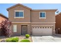 Exterior shot of two-story home with desert landscaping and neutral colored stucco at 9173 Weeping Hollow Ave, Las Vegas, NV 89178
