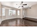 Spacious living room featuring hardwood flooring, large windows, and natural light at 9305 Hollycrest Dr, Las Vegas, NV 89117