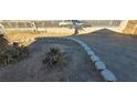 Front yard featuring decorative rock border and low-maintenance landscaping at 1301 Madison Ave, Las Vegas, NV 89106