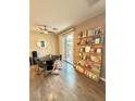 Cozy dining area with sliding glass doors and built in book shelf at 1355 Grass Creek Ave # 1, Henderson, NV 89012
