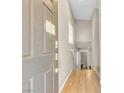 Inviting entryway with wood-look floors, tall ceilings, and a stairway to the upper level at 156 Campbelltown Ave, Henderson, NV 89015
