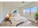 Serene bedroom with a comfortable bed, soft lighting, and a view of the outdoors at 182 Robledo St, Las Vegas, NV 89138