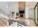 Bright living room featuring a modern fireplace, stylish furnishings, and ample natural light at 182 Robledo St, Las Vegas, NV 89138