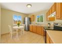 Bright kitchen features stainless steel appliances and eat in nook at 2257 Colebrook St, Las Vegas, NV 89115
