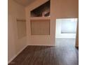 Bright living room boasts modern gray flooring, neutral walls, and multiple windows at 2720 Knightsbridge Rd, Henderson, NV 89074
