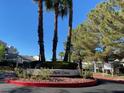 A photo of the property entrance with palm trees and manicured landscaping at 2761 Lodestone Dr # 63, Las Vegas, NV 89117