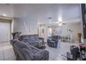 Spacious living room and dining area with tile floors, comfortable seating, and ample natural light at 320 Ellen Marie Dr, Las Vegas, NV 89110
