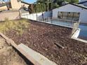 A spacious backyard, enclosed by a chainlink fence with direct access to the pool at 3480 E Hacienda Ave, Las Vegas, NV 89120