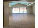 Bright and airy living room with large windows overlooking the backyard pool at 3480 E Hacienda Ave, Las Vegas, NV 89120