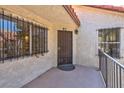Cozy condo entrance featuring a secure metal door and barred windows for added privacy and classic charm at 3609 Melonies Dr # 93, Las Vegas, NV 89103