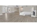 Spacious living room featuring wood flooring, fireplace and open layout at 3849 Boca Chica Ave, Las Vegas, NV 89120