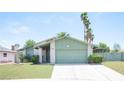 Delightful single-story home with tidy front yard and attached garage at 4409 Rosebank Cir, Las Vegas, NV 89108
