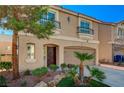 Lovely two-story home featuring a well-manicured lawn and inviting front entrance at 4535 Mission Meadow Cir, Las Vegas, NV 89139