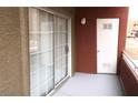A cozy balcony offers outdoor space with sliding glass doors and an exterior door at 4730 E Craig Rd # 1148, Las Vegas, NV 89115