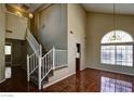 Spacious living room with vaulted ceiling and tile floors at 5115 Blossom Ave, Las Vegas, NV 89142