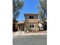 A view of the exterior elevation of the home with an attached garage and landscaped yard at 5280 Shreve Ave, Las Vegas, NV 89156