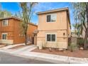 Charming home showcasing stucco architecture, a manicured front yard, and a private driveway at 5280 Shreve Ave, Las Vegas, NV 89156