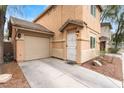 Attached garage providing convenient parking with an adjacent front entrance at 5280 Shreve Ave, Las Vegas, NV 89156