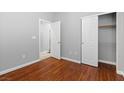 Comfortable bedroom featuring hardwood floors, a closet, and a bright, airy feel at 5452 Tinker Toy Ave, Las Vegas, NV 89139