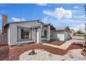 Charming single-story home featuring desert landscaping, a covered entrance, and a well-maintained front yard at 6553 Baywood Ave, Las Vegas, NV 89103