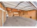 Spacious two-car garage featuring ample storage cabinets and workbench at 6553 Baywood Ave, Las Vegas, NV 89103