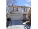 Charming two-story home with well-maintained landscaping, attached two-car garage and inviting arched entryway at 8149 Palace Monaco Ave, Las Vegas, NV 89117