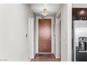 Hallway leading to the unit's front door, with a view of kitchen and dining area at 8255 Las Vegas Blvd # 1219, Las Vegas, NV 89123