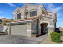 Beautiful two-story home featuring a tile roof, neutral stucco, and a two car garage at 8316 Maplestar Rd, Las Vegas, NV 89128