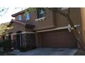 Charming two-story home with a two-car garage, and manicured landscaping at 8749 Brilliant Star Dr, Las Vegas, NV 89178