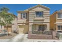 Attractive two-story home with an attached garage, covered porch, and well-maintained landscaping at 10456 Prairie Schooner Ave, Las Vegas, NV 89129